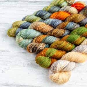 A skein of each of the variegated colorways of the Kilt-y Pleasures collection