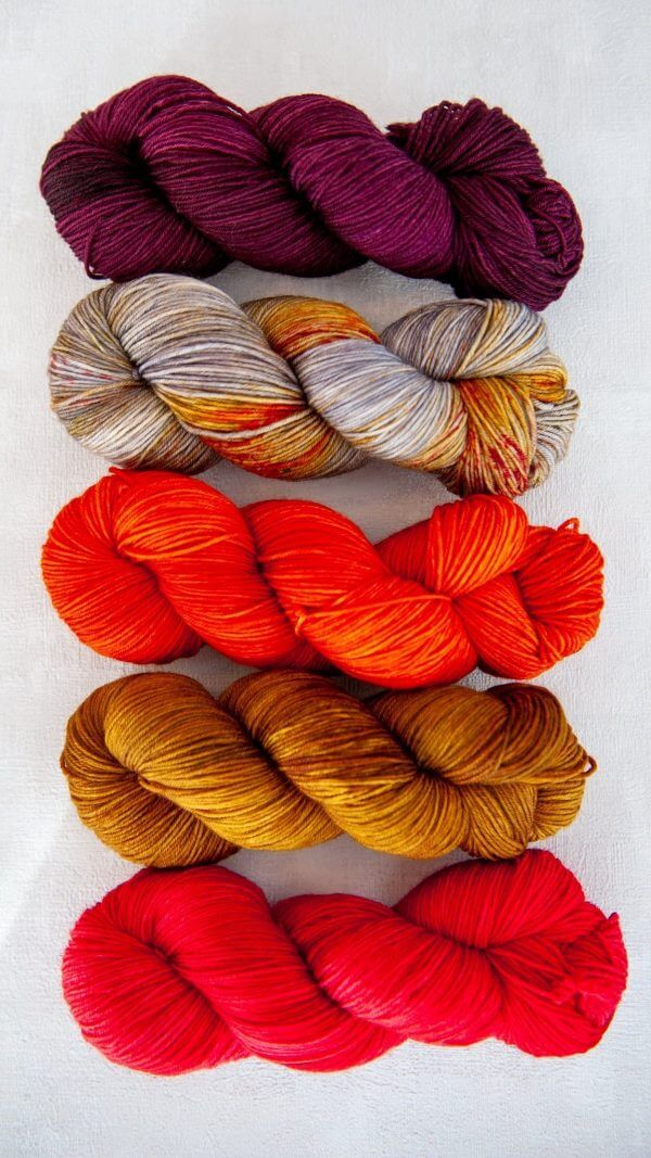 All five colors of main skeins for the sock sets next to each other