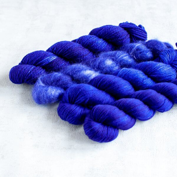 four skeins of dark blue yarn